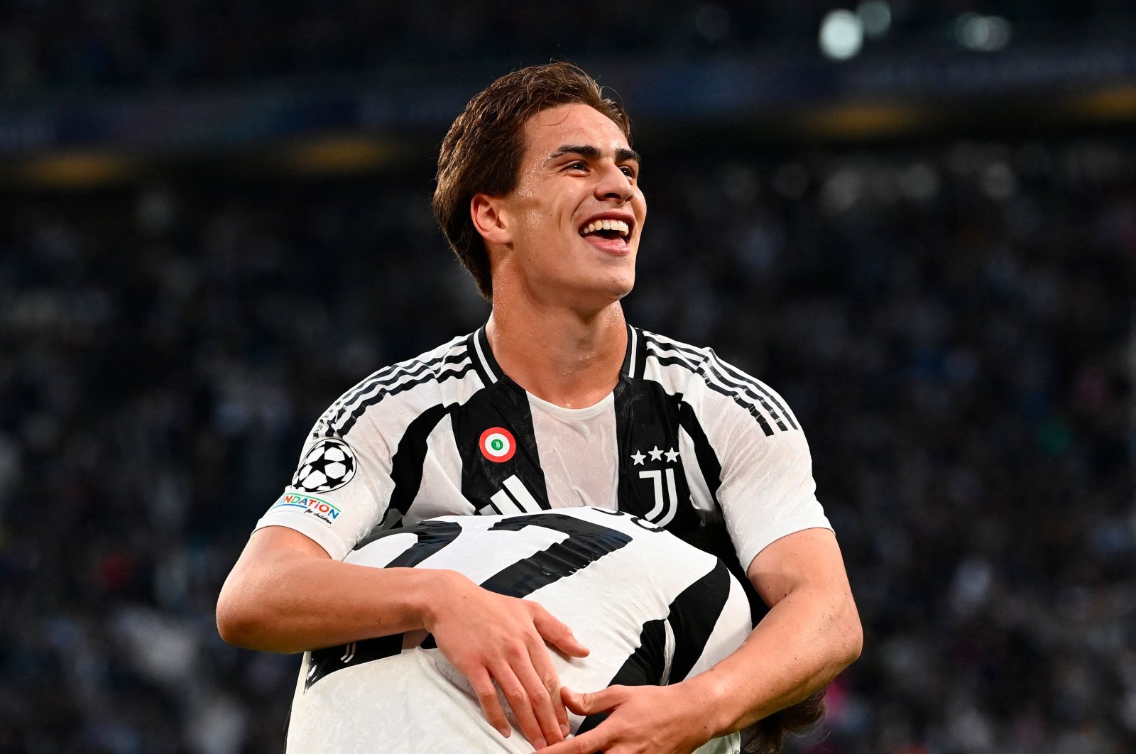 Juventus&#039; Turkish forward Kenan Yildiz celebrates scoring his team&#039;s first goal during the UEFA Champions League match against PSV Eindhoven, Turin, Italy, Sept. 17, 2024. (AFP Photo)