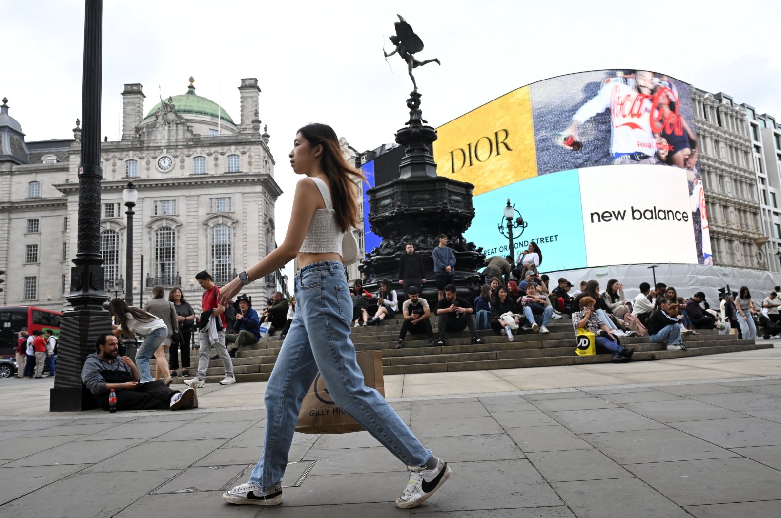 A shopper walks in Piccadilly Circus in London, Britain, Sept. 2, 2024. (Reuters Photo)