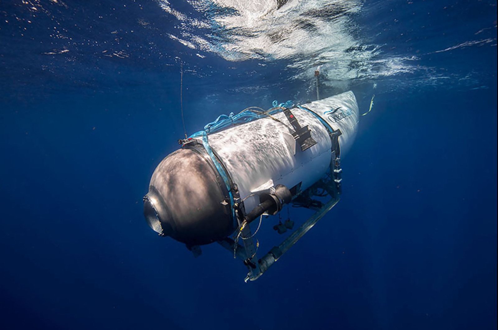 This undated image courtesy of OceanGate Expeditions, shows their Titan submersible beginning a descent. (Photo by Handout / OceanGate Expeditions / AFP) 