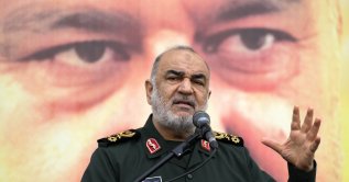 Chief of Iran&#039;s paramilitary Revolutionary Guard Gen. Hossein Salami addresses in front of the portrait of Seyed Razi Mousavi, a high-ranking general of the guard, who was killed in an alleged Israeli airstrike in Syria on Monday, during his funeral ceremony in Tehran, Iran, Thursday, Dec. 28, 2023. (AP File Photo)