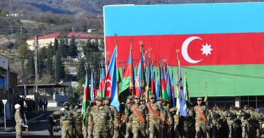 Azerbaijani troops march during a parade dedicated to the third anniversary of the victory in the Patriotic War, weeks after Baku regained full control of the region, Khankendi, Karabakh, Azerbaijan, Nov. 8, 2023. (AP Photo)