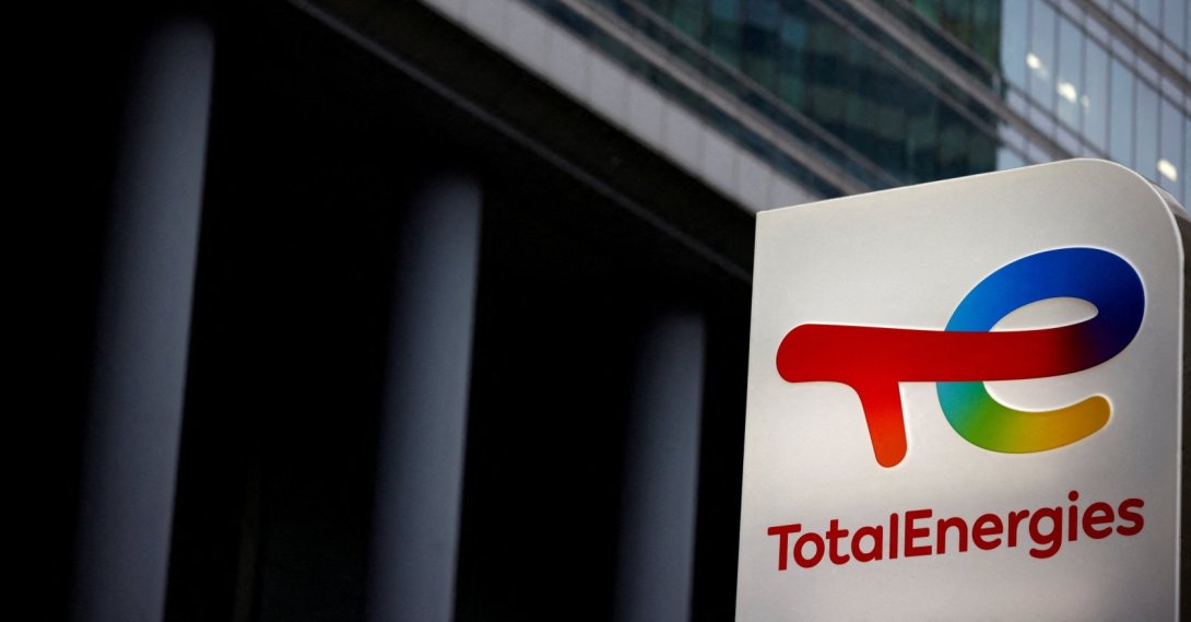 The logo of French oil and gas company TotalEnergies is pictured at an electric car charging station and petrol station at the financial and business district of La Defense in Courbevoie near Paris, France, June 22, 2021. (Reuters Photo)