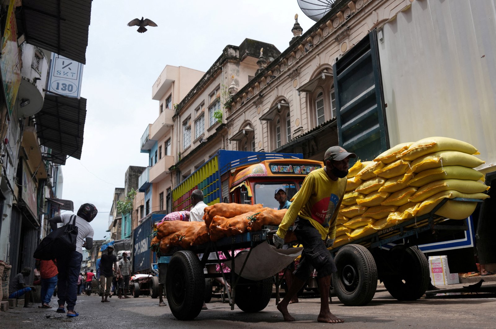 A laborer pulls a handcart loaded with potato sacks in a market area in Colombo, Sri Lanka, Sept. 9, 2024. (Reuters Photo)