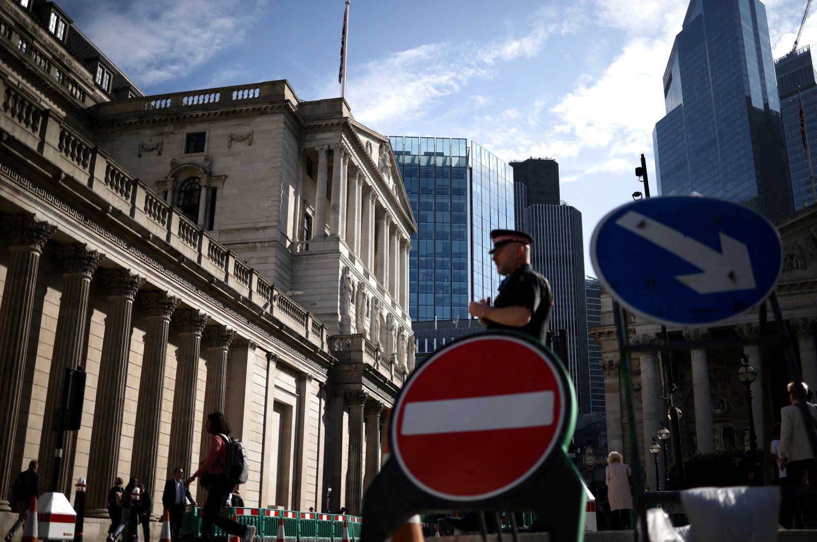 People walk outside the Bank of England in the City of London financial district in London, U.K., May 11, 2023. (Reuters Photo)