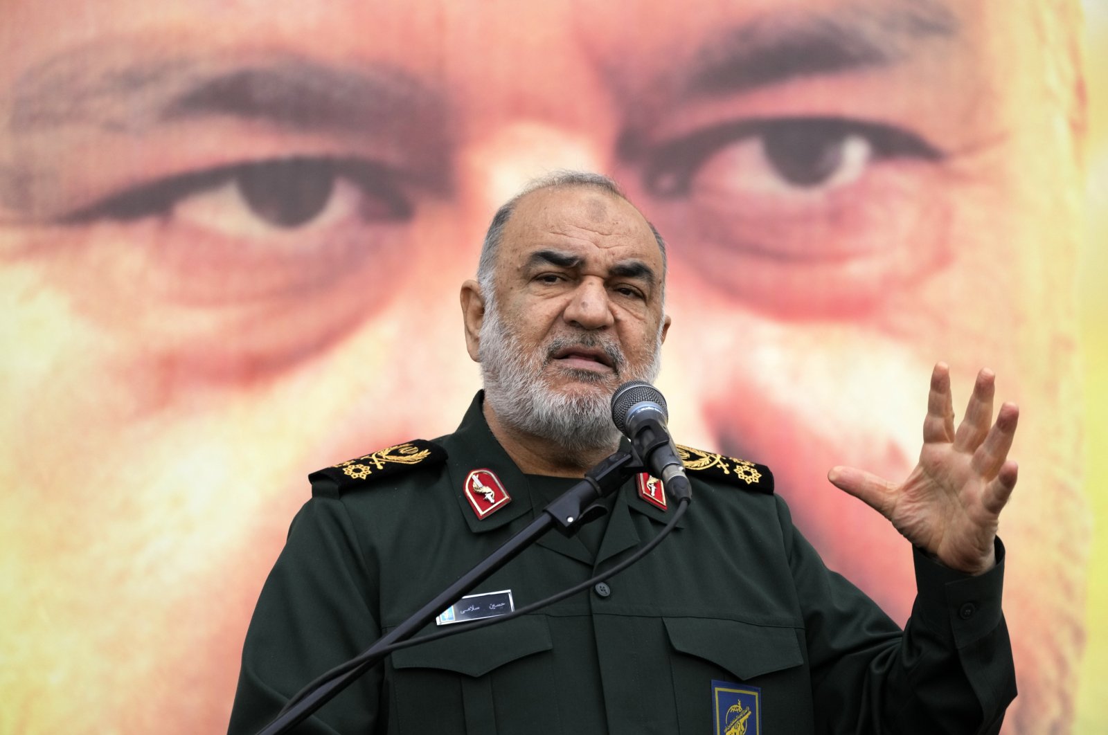 Chief of Iran&#039;s paramilitary Revolutionary Guard Gen. Hossein Salami addresses in front of the portrait of Seyed Razi Mousavi, a high-ranking general of the guard, who was killed in an alleged Israeli airstrike in Syria on Monday, during his funeral ceremony in Tehran, Iran, Thursday, Dec. 28, 2023. (AP File Photo)