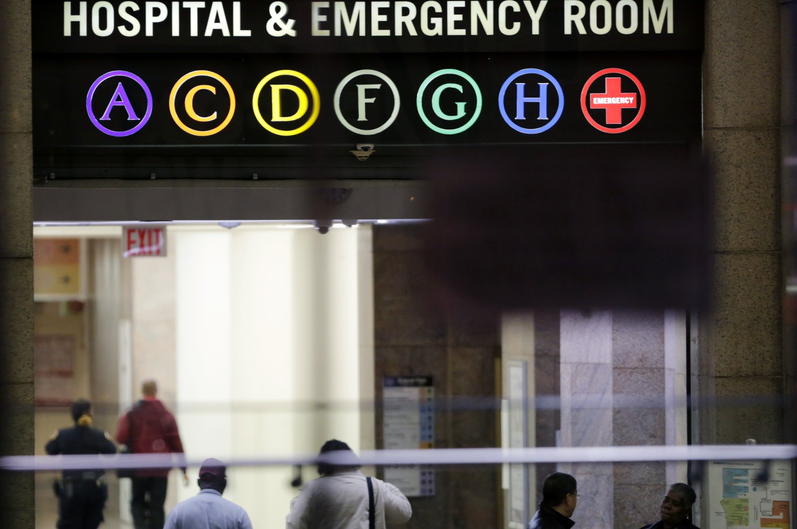 People walk through the lobby of Bellevue Hospital in New York, Friday, Oct. 24, 2014. (AP File Photo)