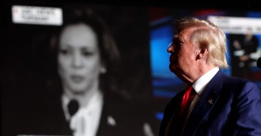 Republican presidential nominee, former U.S. President Donald Trump, watches a video of Vice President Kamala Harris during a campaign rally at The Expo at World Market Center Las Vegas, Nevada, U.S., Sept. 13, 2024. (AFP Photo)