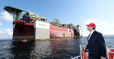 Energy and Natural Resources Minister Alparslan Bayraktar looks at Türkiye&#039;s first floating production, storage and offloading (FPSO) platform, off Çanakale, northwestern Türkiye, Sept. 20, 2024. (AA Photo)