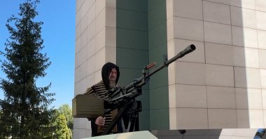 This video grab taken from a handout footage released on the official Telegram account of the Head of Chechen Republic on Aug. 17, 2024, shows Chechen leader Ramzan Kadyrov standing atop a gun-mounted Tesla Cybertruck in Grozny, Chechnya. (Photo by Handout / Telegram: @rkadyrov_95 via AFP) 