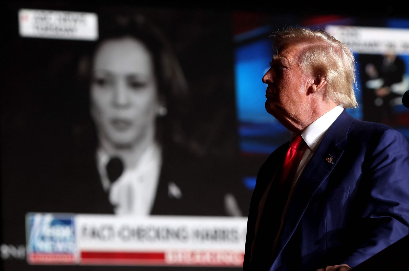 Republican presidential nominee, former U.S. President Donald Trump, watches a video of Vice President Kamala Harris during a campaign rally at The Expo at World Market Center Las Vegas, Nevada, U.S., Sept. 13, 2024. (AFP Photo)