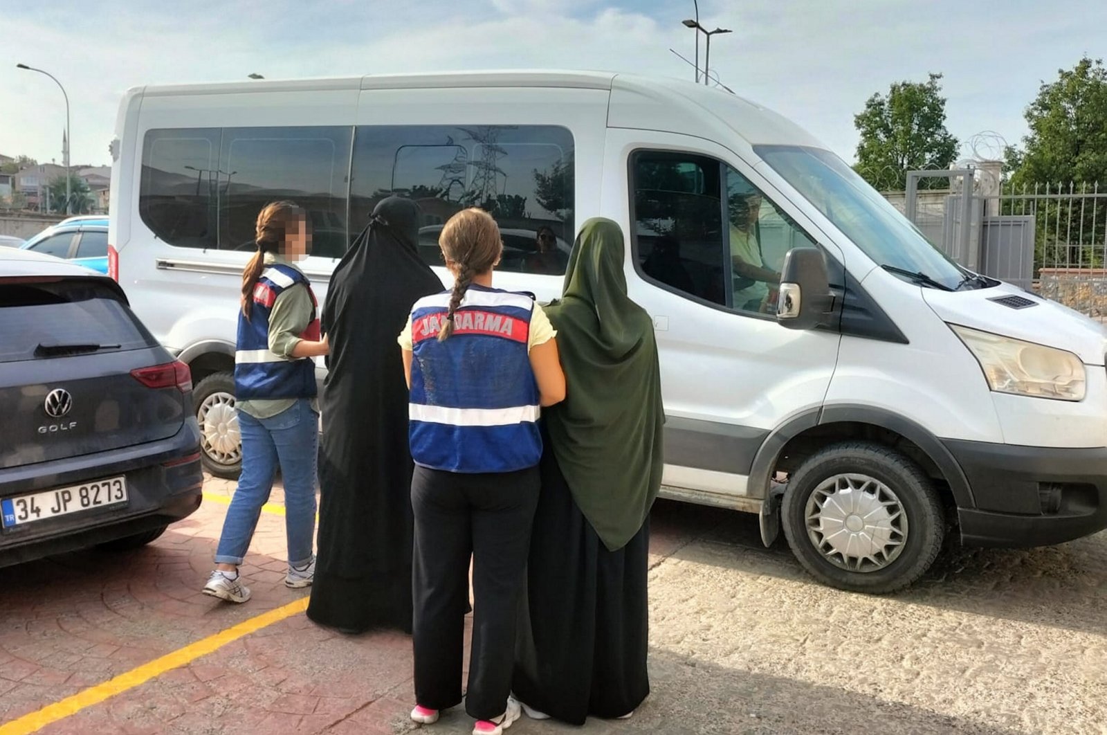 Gendarmerie officers escort two Daesh suspects captured in western Izmir province, Türkiye, Sept. 10, 2024. (AA Photo)