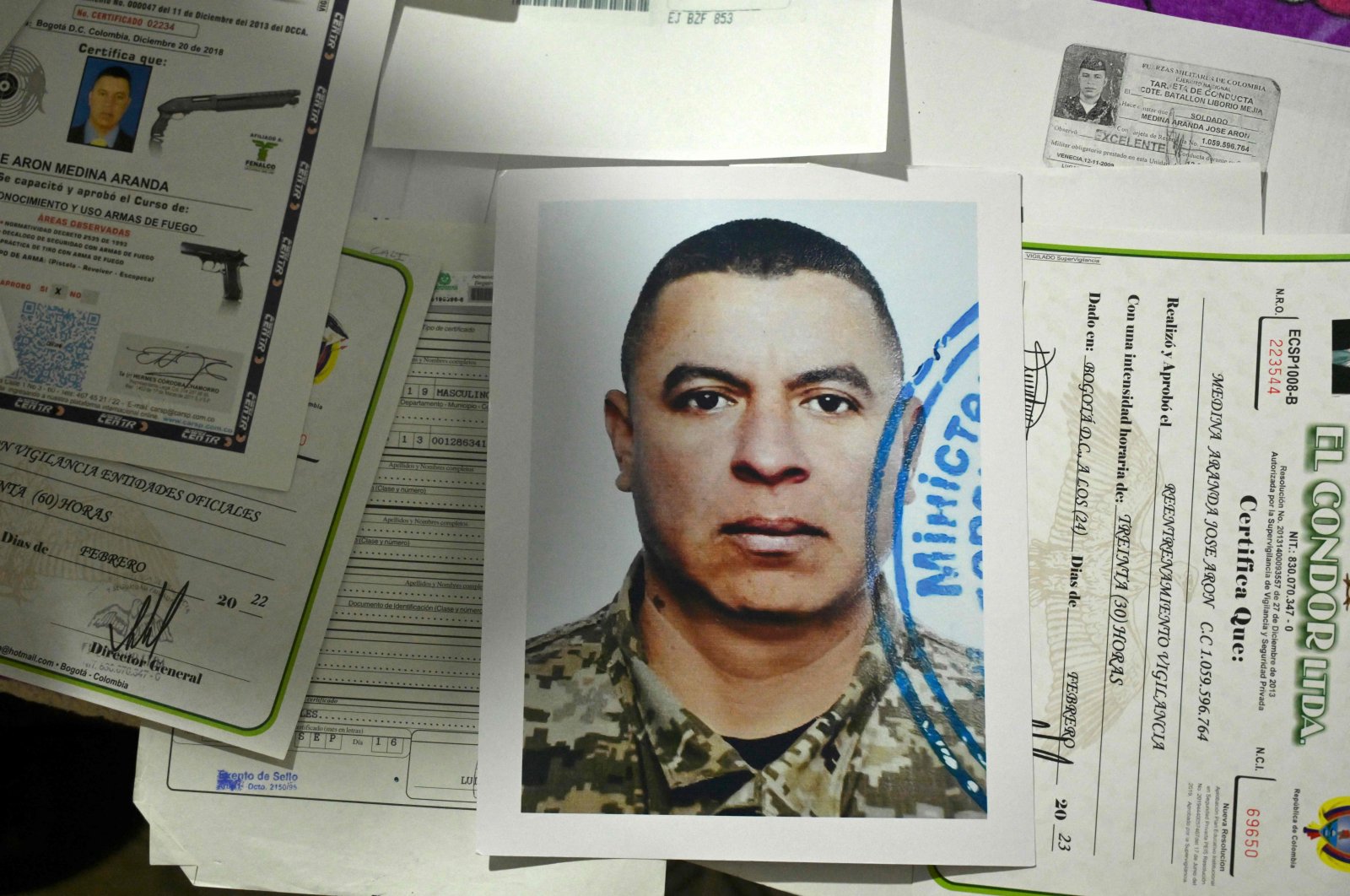 A picture of retired Colombian military officer Jose Medina is seen next to other documents at his house, Popayan, Cauca department, Colombia, Sept. 13, 2024. (AFP Photo)