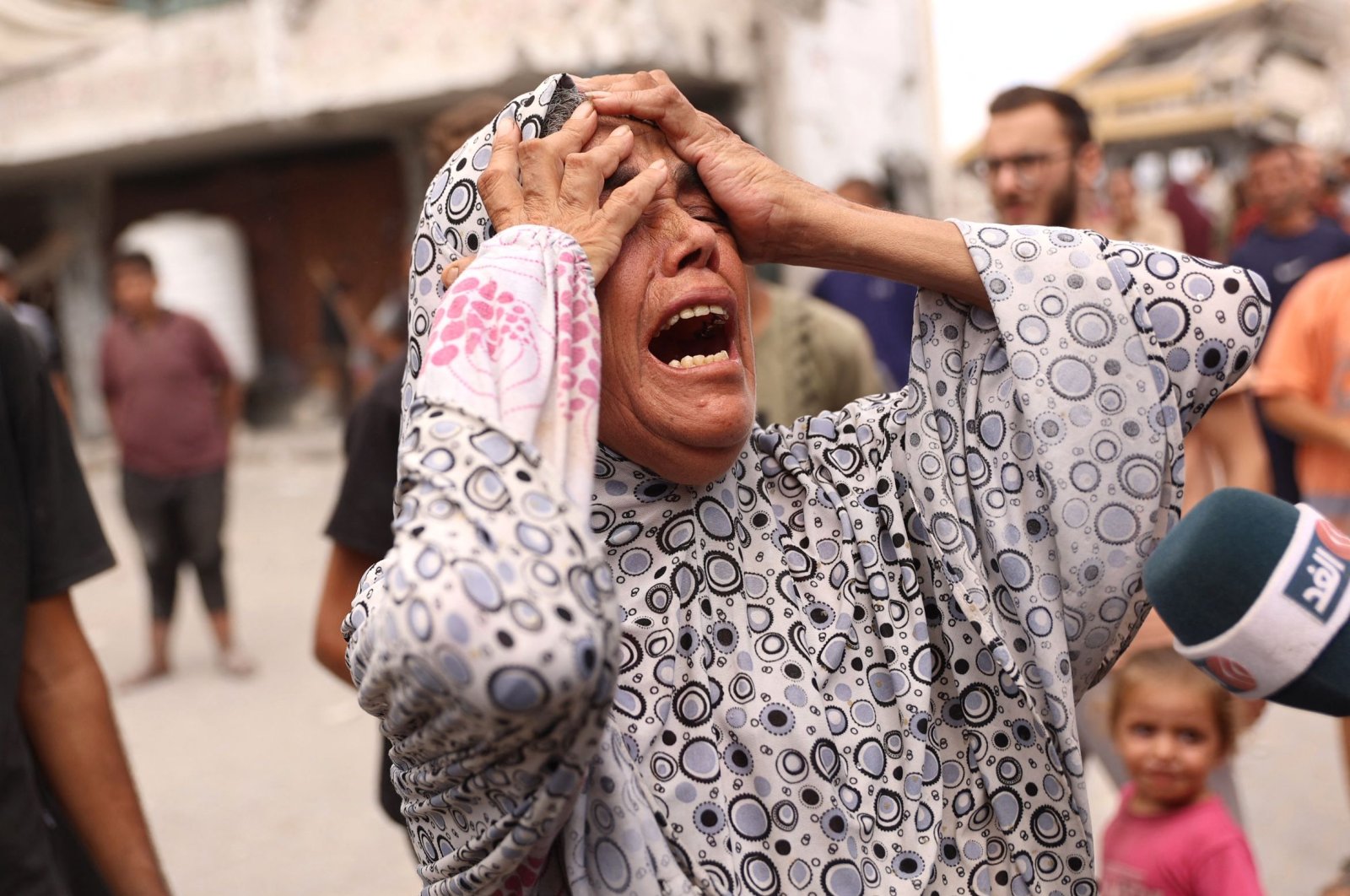 A woman reacts after a school used as shelter by displaced Palestinians was hit by an Israeli strike in the Shujaiya neighborhood, Gaza City, Palestine, Sept. 18, 2024. (AFP Photo)