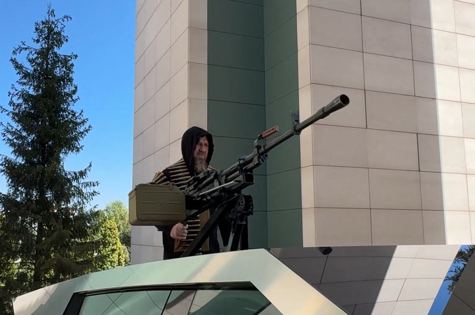 This video grab taken from a handout footage released on the official Telegram account of the Head of Chechen Republic on Aug. 17, 2024, shows Chechen leader Ramzan Kadyrov standing atop a gun-mounted Tesla Cybertruck in Grozny, Chechnya. (Photo by Handout / Telegram: @rkadyrov_95 via AFP) 