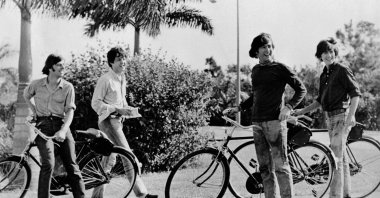 From left to right, The Beatles members including, Ringo Starr, Paul McCartney, John Lennon and George Harrison have fun riding bicycles in the 1960s. (Getty Images)