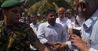 National People&#039;s Power presidential candidate Anura Kumara Dissanayake (C) shakes hands with a supporter in Colombo, Sri Lanka, Sept. 21, 2024. (Reuters Photo)