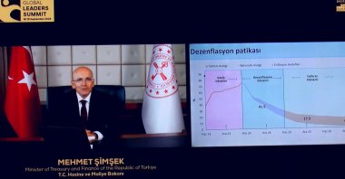 Treasury and Finance Minister Mehmet Şimşek delivers a video message during a summit, Istanbul, Türkiye, Sept. 19, 2024. (DHA Photo)