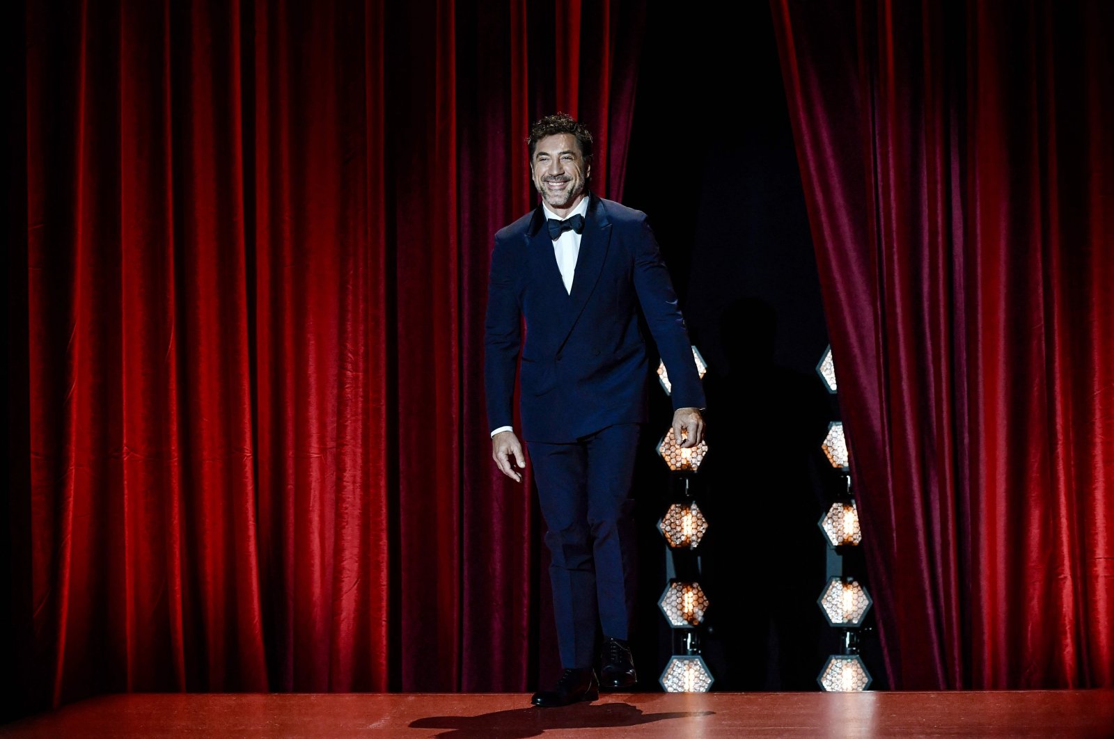 Spanish actor Javier Bardem smiles as he takes the stage to receive the Donostia Lifetime Achievement Award in recognition of his distinguished film career during the opening gala of the 72nd San Sebastian International Film Festival, San Sebastian, Spain, Sept. 20, 2024. (AFP Photo)