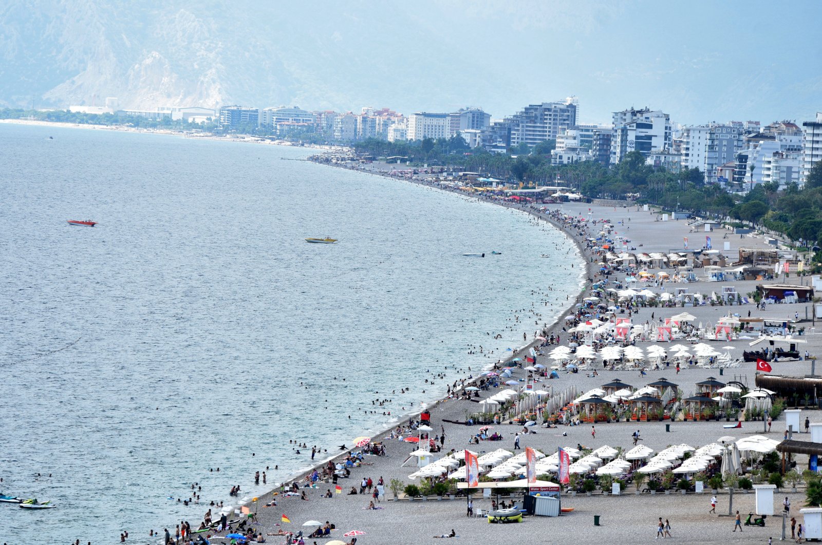 An aerial view of the people enjoying warm September weather at the famous Konyaaltı beach in Antalya, southern Türkiye, Sept. 21, 2024. (DHA Photo)