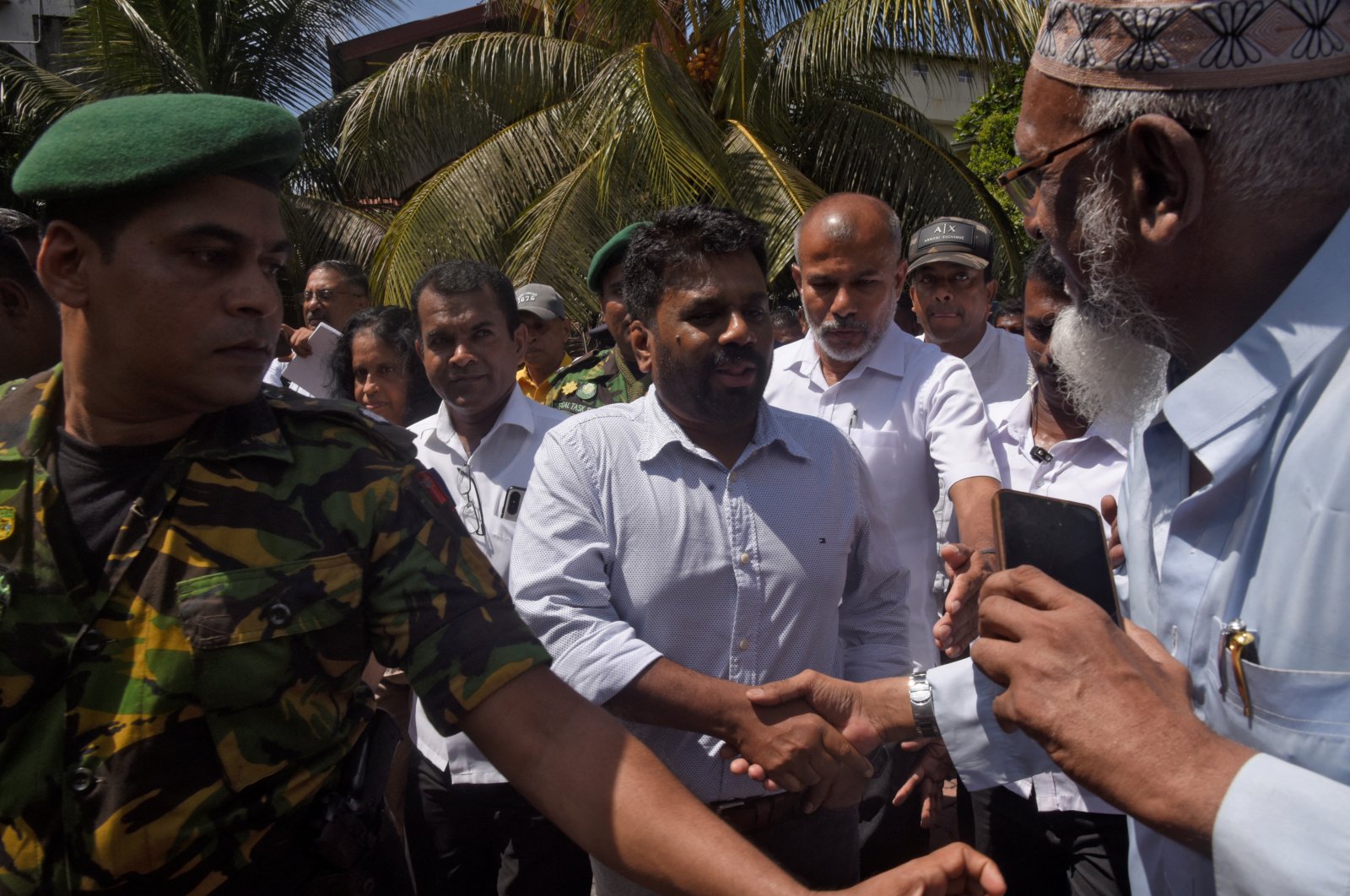 National People&#039;s Power presidential candidate Anura Kumara Dissanayake (C) shakes hands with a supporter in Colombo, Sri Lanka, Sept. 21, 2024. (Reuters Photo)