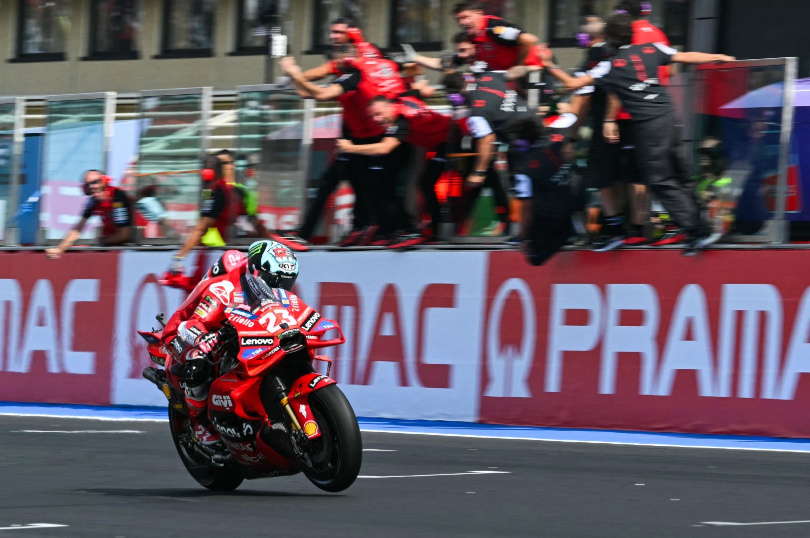 Ducati Lenovo Team&#039;s Italian rider Enea Bastianini crosses the finish line and celebrates as he wins the MotoGP Emilia-Romagna Grand Prix, Misano Adriatico, Italy, Sept. 22, 2024. (AFP Photo)