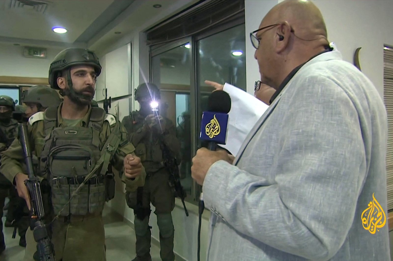 An image grab shows an Israeli soldier speaking with Walid al-Omari, bureau chief of Al Jazeera in Jerusalem and Ramallah, occupied West Bank, Palestine, Sept. 22, 2024. (AFP Photo)