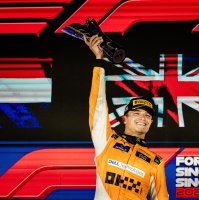 British driver Lando Norris of McLaren F1 Team celebrates on the podium after winning the Singapore Formula One Grand Prix at the Marina Bay Street Circuit, Singapore, Sept. 22, 2024. (EPA Photo)