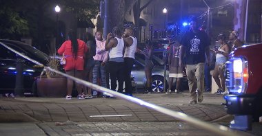 Bystanders near the scene of a shooting in Birmingham, Alabama, Sept. 22, 2024. (AP Photo)