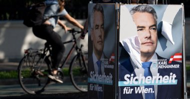 Head of the Austrian People’s Party (OeVP) and Austrian Chancellor Karl Nehammer is seen on an election campaign poster outside parliament, Vienna, Austria, Sept. 20, 2024. (AFP Photo)