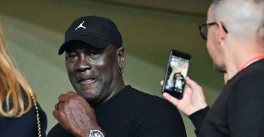 U.S. former basketball player Michael Jordan (C) attends the UEFA Champions League first round Day 1 football match between Monaco and Barcelona at the Louis II Stadium, Monaco, Sept. 19, 2024. (AFP Photo)