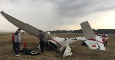 The wreckage of the plane lies overturned on the apron of Yenişehir Airport, Bursa, Türkiye, Sept. 23, 2024. (IHA Photo)