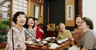 Six senior women having tea, laughing in Japan, Sept. 3, 2005. (Getty Images)
