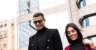 Cristiano Ronaldo leaves from the provincial court of Madrid with his girlfriend Georgina Rodriguez from his tax evasion trial, Madrid, Spain, Jan. 22, 2022. (Getty Images Photo)