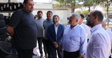 Ruling Justice and Development Party (AK Party) Deputy Chair Vedat Demiröz (2nd R) listens to a shopkeeper during a visit to an industrial site as part of his party's “Türkiye meetings,” southwestern Burdur province, Türkiye, Sept. 20, 2024. (AA Photo)
