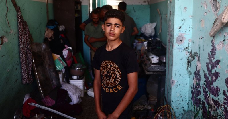 A Palestinian boy weeps as he checks the damage at a school room sheltering displaced people after an Israeli airstrike hit the site, in Nuseirat, central Gaza Strip, Sept. 23, 2024. (AFP Photo)