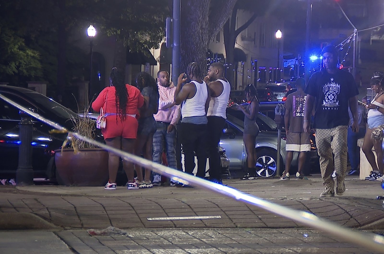 Bystanders near the scene of a shooting in Birmingham, Alabama, Sept. 22, 2024. (AP Photo)