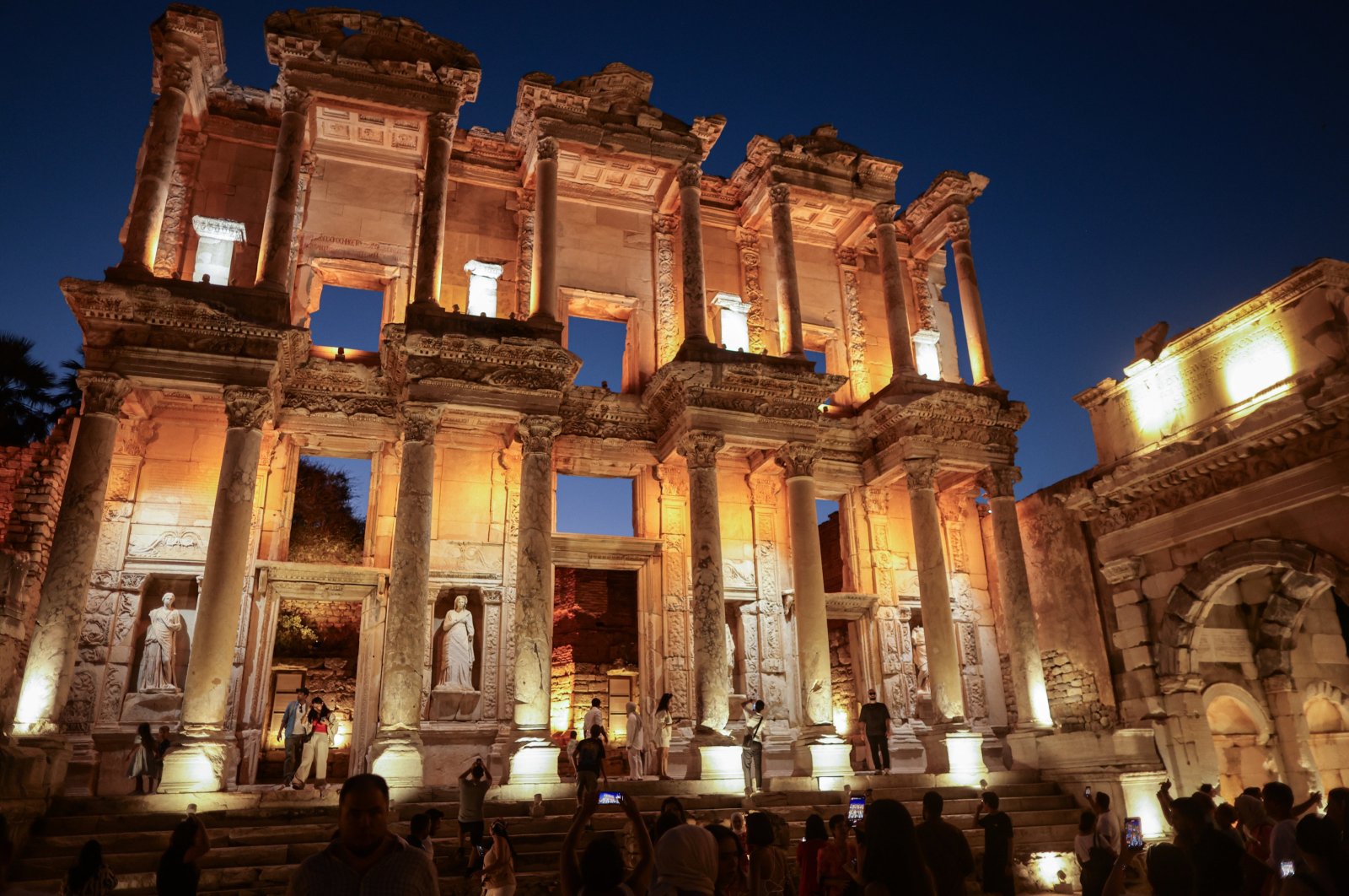 People visit the Library of Celsus at the ancient city of Ephesus within the scope of the night museum project in the Selcuk district of Izmir, Türkiye, Sept. 11, 2024. (EPA Photo)