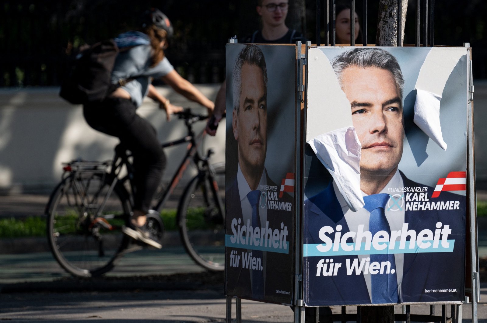 Head of the Austrian People’s Party (OeVP) and Austrian Chancellor Karl Nehammer is seen on an election campaign poster outside parliament, Vienna, Austria, Sept. 20, 2024. (AFP Photo)