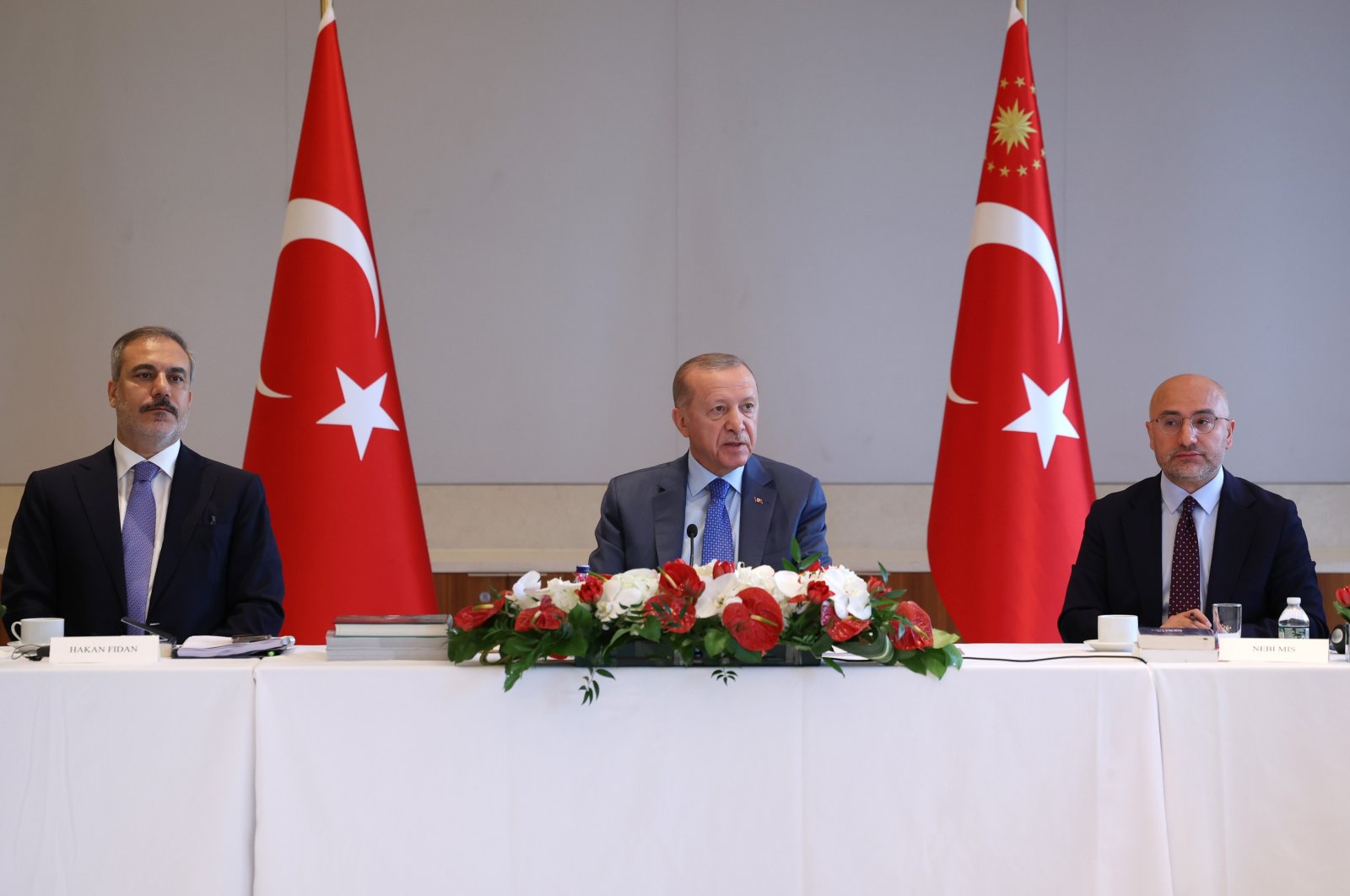 President Recep Tayyip Erdoğan (C), next to Foreign Minister Hakan Fidan (L) and think tank SETA&#039;s General Coordinator Nebi Miş, speaks at an event in Turkish House (Türkevi), New York, U.S., Sept. 22, 2024. (İHA Photo)