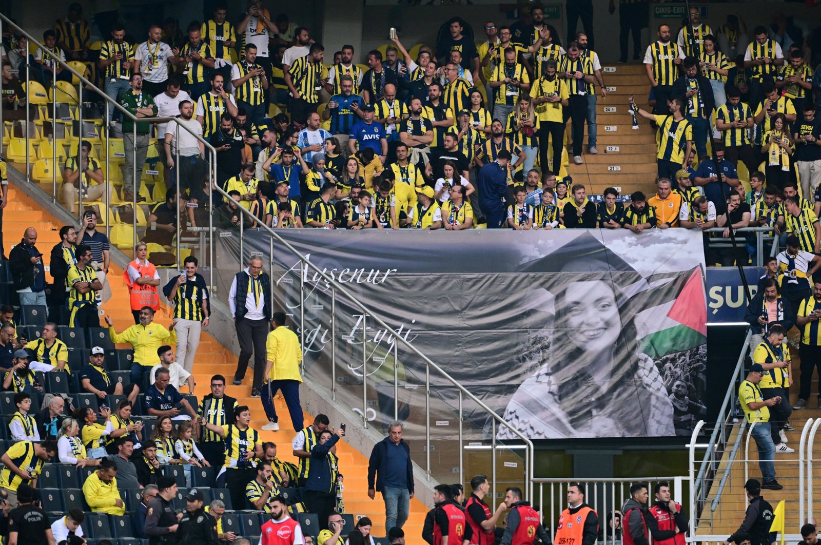 Fenerbahçe fans unfurl a banner with photo of Ayşenur Ezgi Eygi before a match against Galatasaray in Istanbul, Türkiye, Sept. 21, 2024. (AA Photo) 