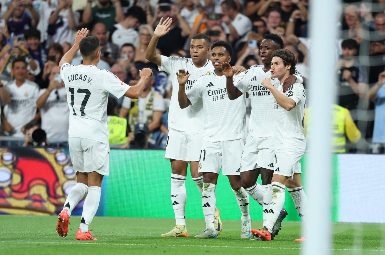 Real Madrid players celebrate a goal during the Spanish league football match against Espanyol at Santiago Bernabeu Stadium, Madrid, Spain, Sept. 21, 2024. (AFP Photo)