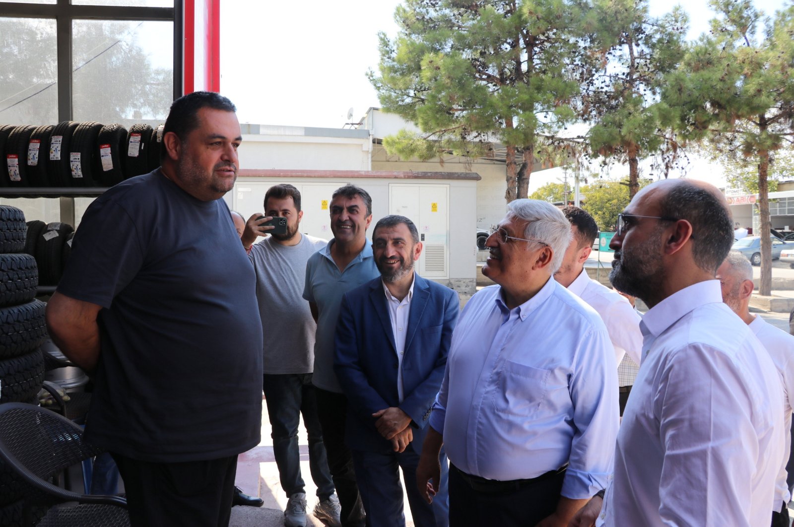 Ruling Justice and Development Party (AK Party) Deputy Chair Vedat Demiröz (2nd R) listens to a shopkeeper during a visit to an industrial site as part of his party&#039;s “Türkiye meetings,” southwestern Burdur province, Türkiye, Sept. 20, 2024. (AA Photo)