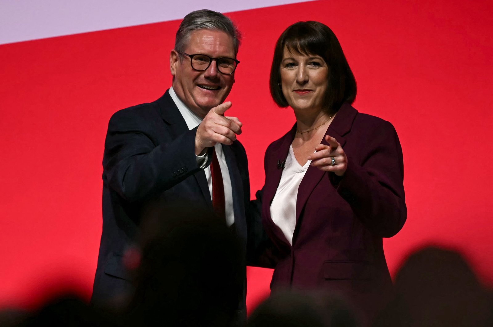 Britain&amp;#039;s Treasury chief Rachel Reeves reacts with Prime Minister Keir Starmer after speaking on the second day of the annual Labour Party conference in Liverpool, northwest England, Sept. 23, 2024. (AFP Photo)