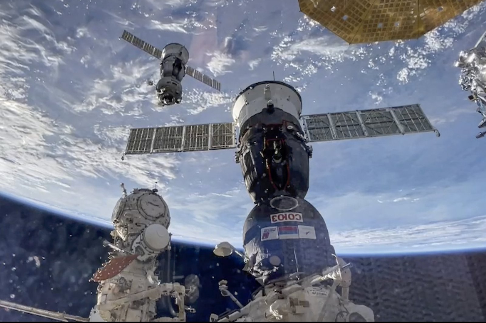 A handout still image taken from a handout video provided by the Russian Space Agency Roscosmos press-service shows the undocking of Soyuz MS-25 with participants of the 70th and 71st long-term expeditions, cosmonauts of the Roscosmos State Corporation Oleg Kononenko and Nikolai Chub, who spent a year on the International Space Station, as well as NASA astronaut Tracy Dyson, Sept. 23, 2024. (EPA/Roscosmos Handout)