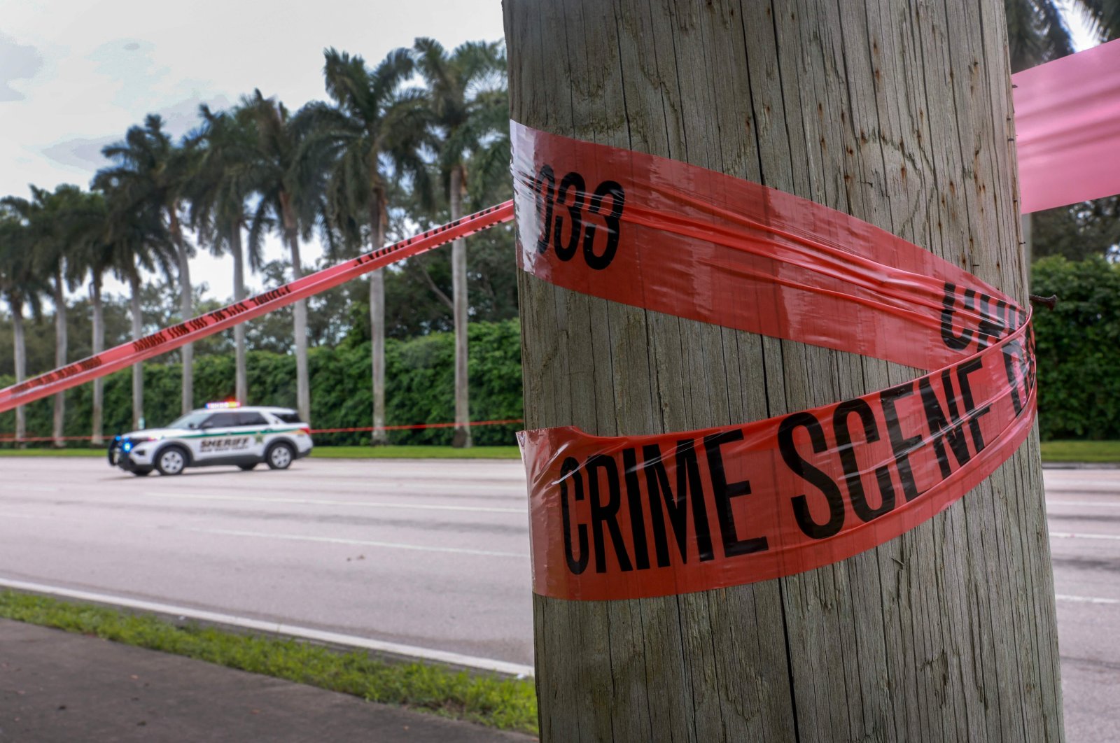 Crime scene tape marks off the area as law enforcement personnel continue to investigate the area where the Secret Service discovered a would-be assassin of former President Donald Trump at the Trump International Golf Club, Sept. 17, 2024. (Getty Images via AFP)