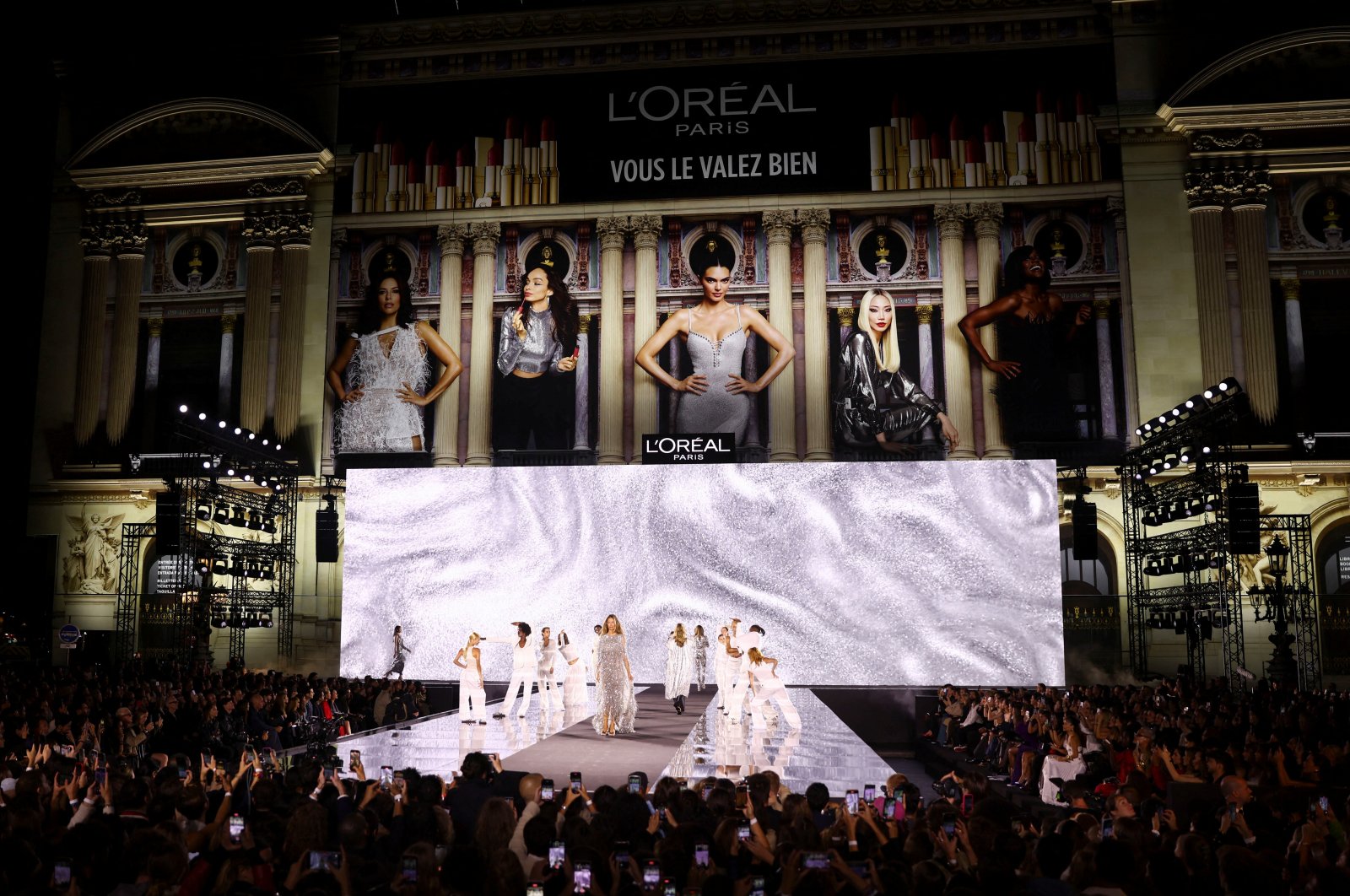 A model presents a creation during a public show named "Walk Your Worth" organized by L&#039;Oreal near the Opera Garnier as part of Paris Fashion Week, Paris, France, Sept. 23, 2024. (Reuters Photo)