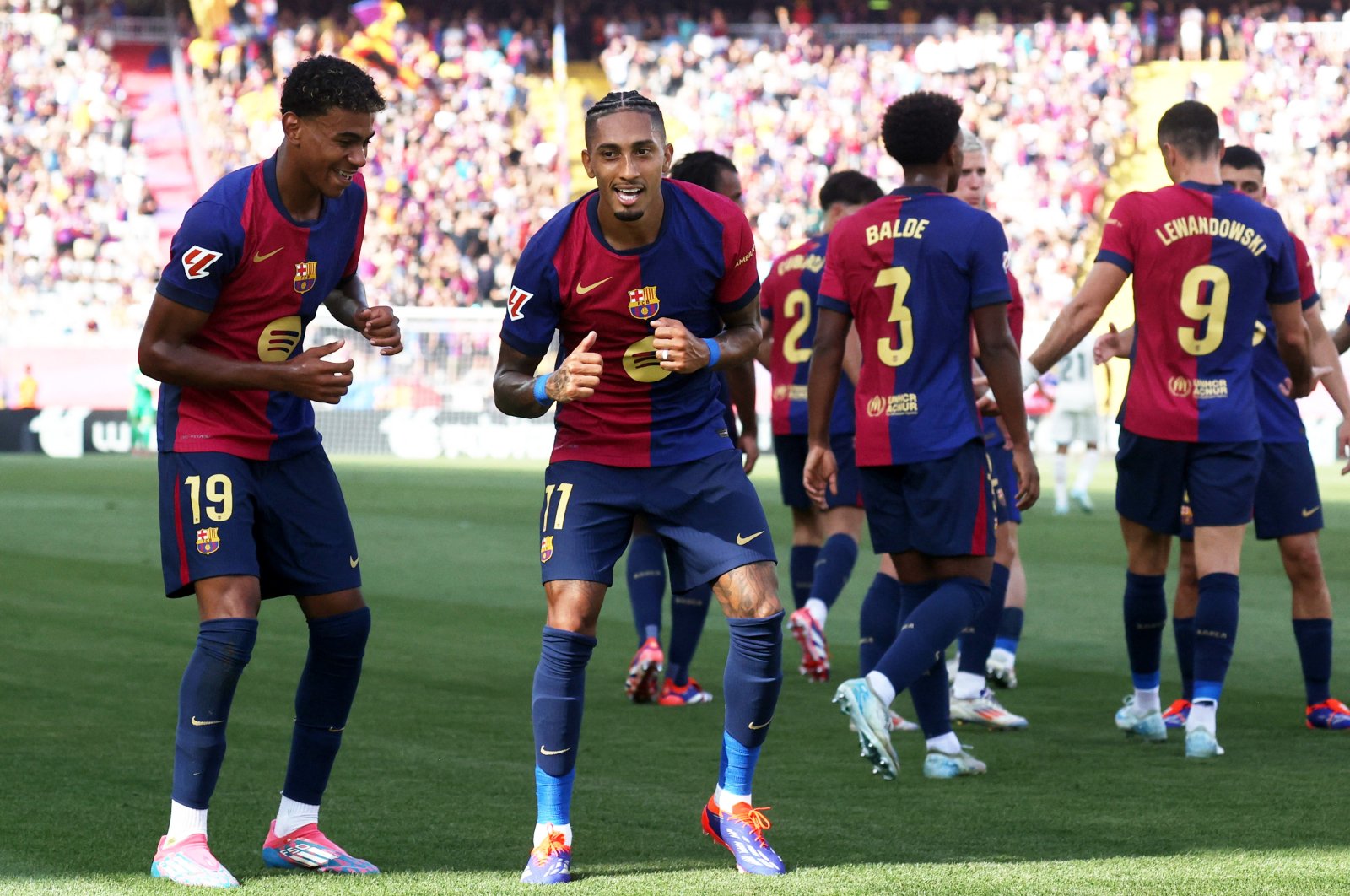 Barcelona&#039;s Raphinha (R) celebrates scoring their first goal with Lamine Yamal during the La Liga match against Real Valladolid, Estadi Olimpic Lluis Companys, Barcelona, Spain, Aug. 31, 2024. (Reuters Photo)