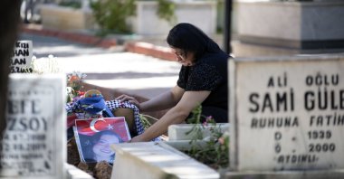 Rabia Birden, mother of Turkish American activist Ayşenur Ezgi Eygi who was shot dead by Israeli soldiers, mourns by her grave in Didim, Aydın, western Türkiye, Sept. 16, 2024. (AA Photo)