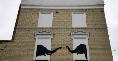 A new artwork by British anonymous street artist Banksy depicts two elephants on the side of a house in Chelsea, London, U.K., Aug. 6, 2024. (EPA Photo)