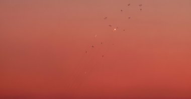  Rockets allegedly fired from southern Lebanon are intercepted by Israel's Iron Dome air defense system over northern Israel on Sept. 23, 2024. (AFP Photo)